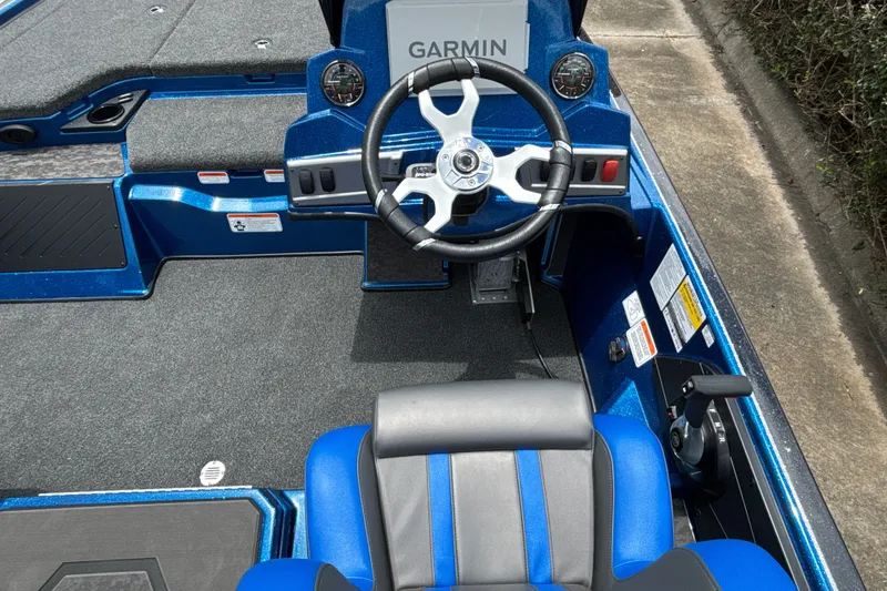 Slide: The Image of 2026 Nitro Z19 XL Pro boat cockpit with Garmin navigation and blue seating. - 14