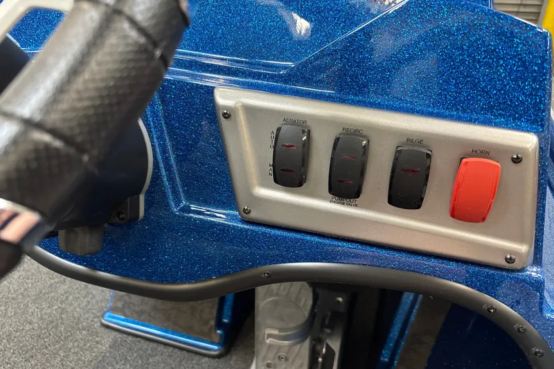 Slide: The Image of Control panel of 2026 Nitro Z19 XL Pro boat with switches and blue metallic finish. - 113