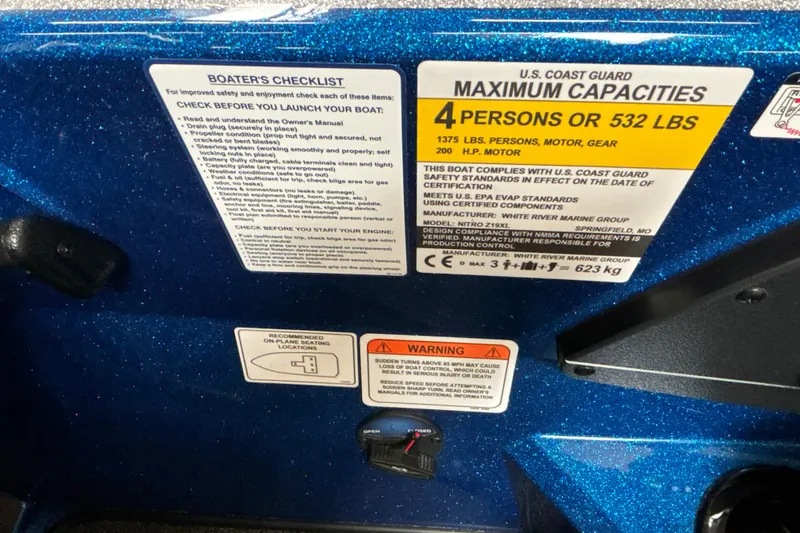 Slide: The Image of 2026 Nitro Z19 XL Pro boat capacity and safety labels, including U.S. Coast Guard compliance. - 36