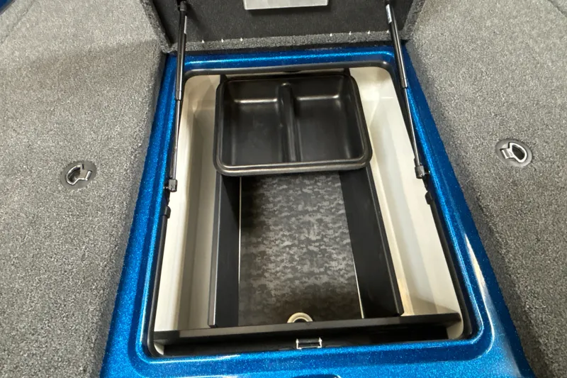 Slide: The Image of Open storage compartment in 2026 Nitro Z19 XL Pro boat, featuring a sleek blue finish. - 28