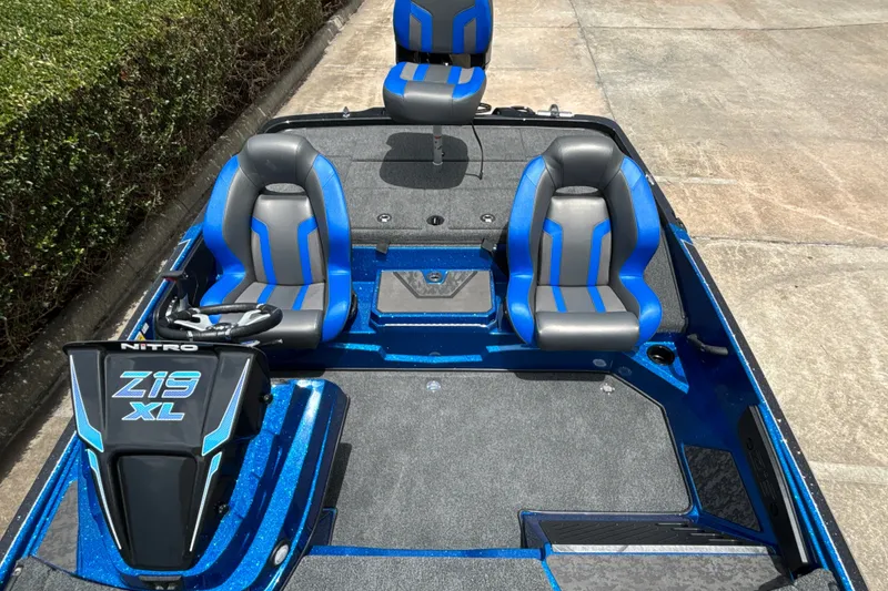 Slide: The Image of 2026 Nitro Z19 XL Pro boat with blue and gray seating, sleek design. - 12