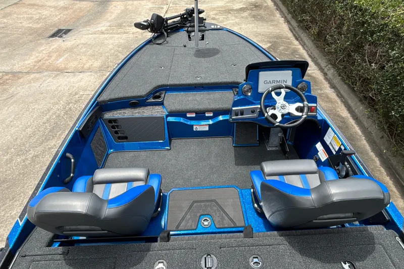 Slide: The Image of 2026 Nitro Z19 XL Pro boat interior with Garmin navigation, blue and gray seating, and modern dashboard. - 13