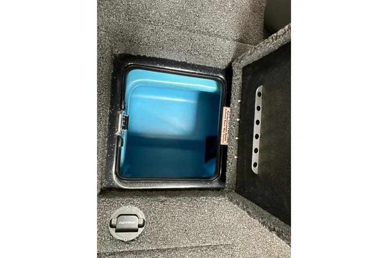Slide: The Image of Storage compartment in 2026 Nitro Z19 XL Pro boat, featuring a blue interior. - 32