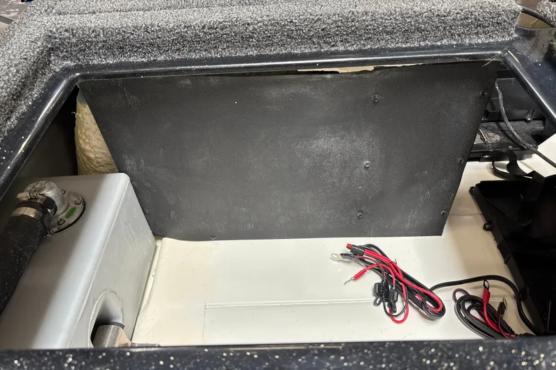 Slide: The Image of Interior view of a 2026 Nitro Z19 XL Pro boat compartment with wiring and components. - 24