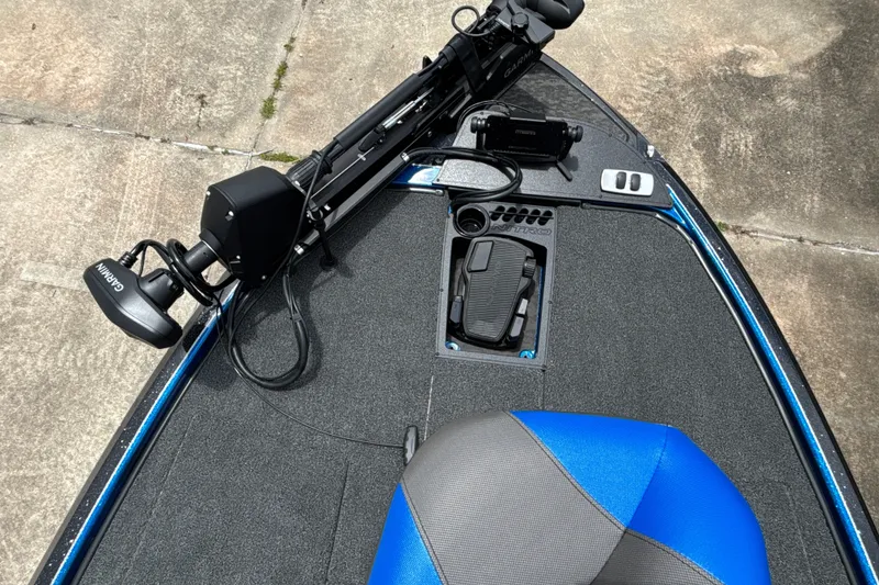 Slide: The Image of 2026 Nitro Z19 XL Pro boat deck with Garmin trolling motor and blue seat. - 8