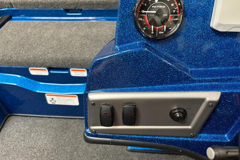 Slide: The Image of Control panel of a 2026 Nitro Z19 XL Pro boat with blue metallic finish. - 20