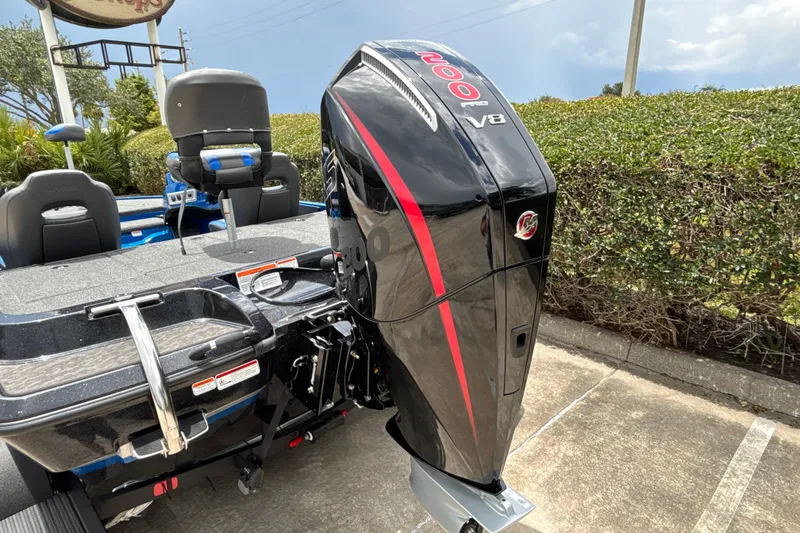 Slide: The Image of 2026 Nitro Z19 XL Pro boat with powerful V8 engine in a parking lot. - 6