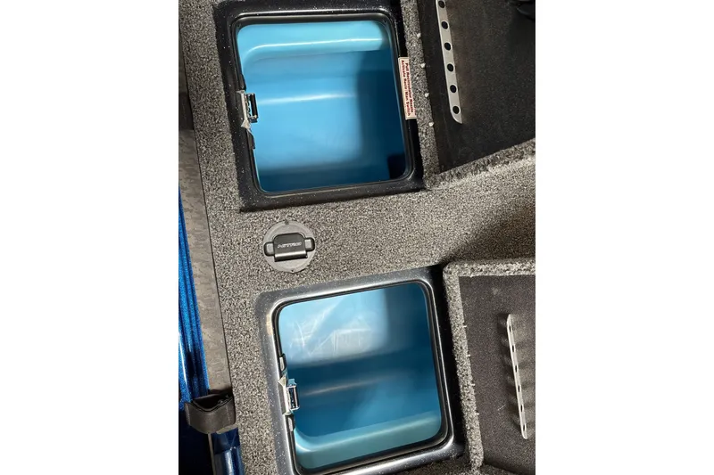 Slide: The Image of 2026 Nitro Z19 XL Pro boat storage compartments with blue interior. - 33