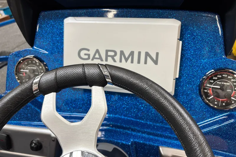 Slide: The Image of Steering wheel and Garmin display on 2026 Nitro Z19 XL Pro boat dashboard. - 17