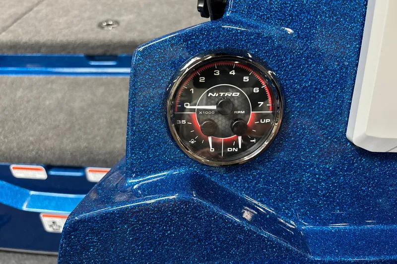 Slide: The Image of Close-up of a 2026 Nitro Z19 XL Pro tachometer on a sparkling blue dashboard. - 18