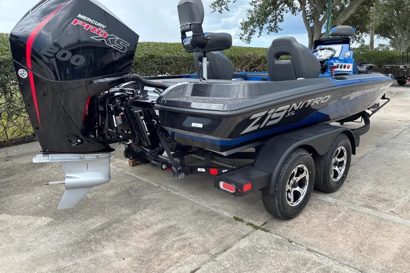 Slide: The Image of The image shows a 2026 Nitro Z19 XL Pro boat with a Mercury 200 HP outboard motor. - 4