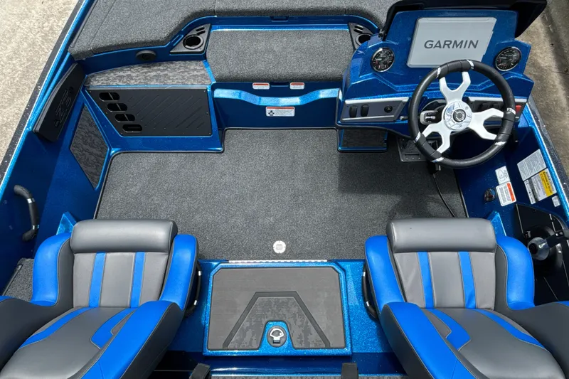 Slide: The Image of 2026 Nitro Z19 XL Pro boat interior with blue seats and Garmin navigation system. - 15