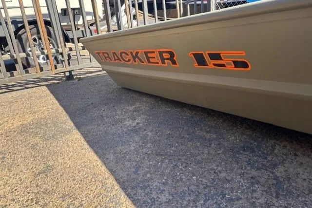 The Image of 2026 Tracker Grizzly 15 Jon boat, side view with bold orange lettering. - 0