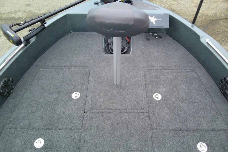 Slide: The Image of 2026 Nitro ZV19 Sport boat deck with carpeted flooring and seating. - 10