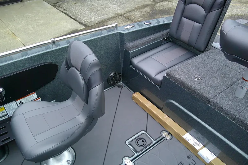 Slide: The Image of Interior of 2026 Nitro ZV19 Sport boat with gray seating and carpeted flooring. - 14