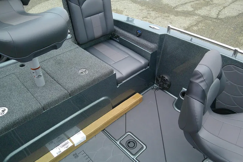 Slide: The Image of 2026 Nitro ZV19 Sport boat interior with gray seating and carpeted flooring. - 15