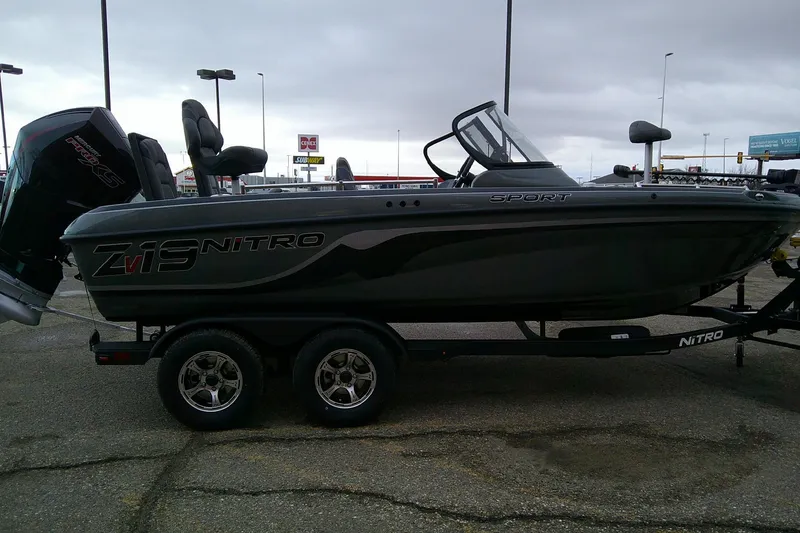 Slide: The Image of 2026 Nitro ZV19 Sport boat on trailer, parked outdoors under cloudy sky. - 4