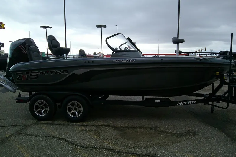 Slide: The Image of 2026 Nitro ZV19 Sport boat on trailer, parked outdoors under cloudy sky. - 5