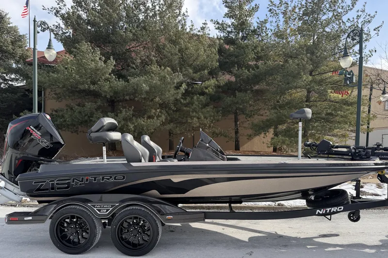 The Image of 2026 Nitro Z19 XL Pro fishing boat on trailer, parked outdoors. - 0