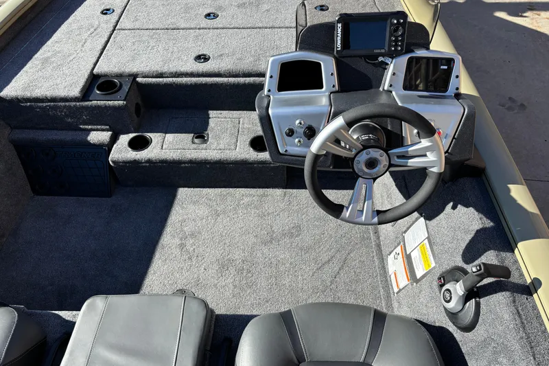 Slide: The Image of 2026 Tracker Pro Team 195 boat interior with steering wheel and control panel. - 5