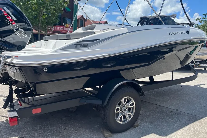 Slide: The Image of 2026 Tahoe T18 boat on trailer, featuring sleek design and Mercury Pro XS engine. - 2