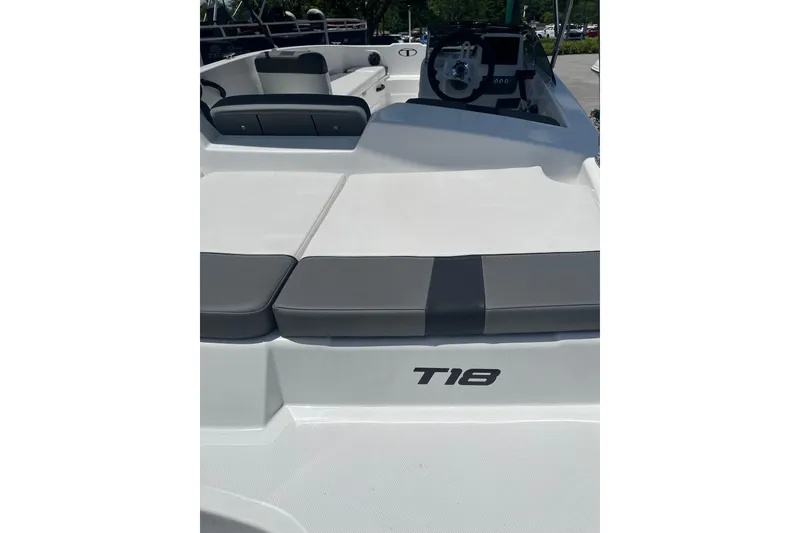 Slide: The Image of 2026 Tahoe T18 boat interior with seating and steering wheel. - 6