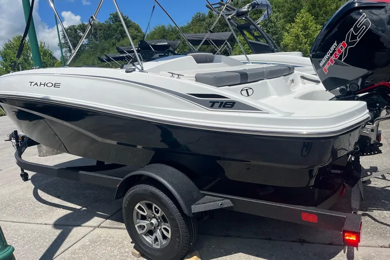 Slide: The Image of 2026 Tahoe T18 boat on trailer, featuring sleek design and Mercury Pro XS engine. - 3