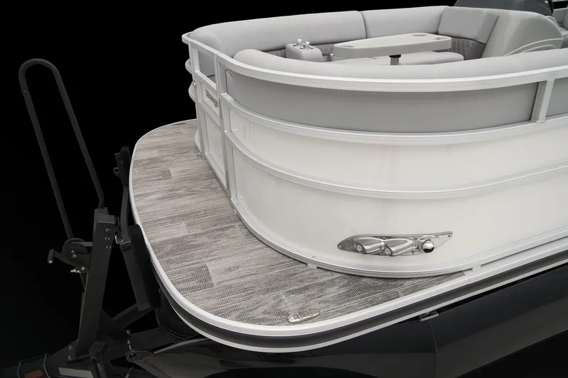 Slide: The Image of 2025 Ranger Reata 243C boat interior with beige seating and wood-style flooring. - 31