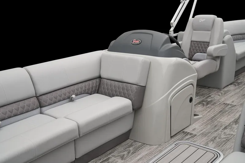 Slide: The Image of 2025 Ranger Reata 243C boat interior with luxurious seating and modern helm design. - 34