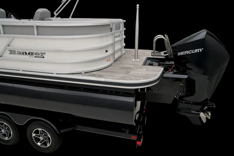 Slide: The Image of 2025 Ranger Reata 243C boat console with audio system and cup holder. - 37