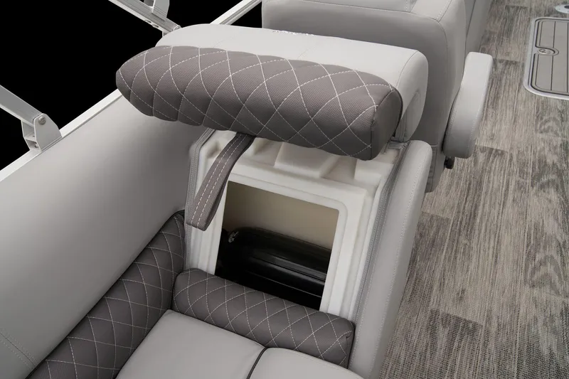 Slide: The Image of 2025 Ranger Reata 243C pontoon boat interior with beige seating and cup holders. - 52