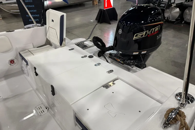 Slide: The Image of 2026 Stingray 173 CC boat with Yamaha SHO VMAX engine, displayed indoors. - 5
