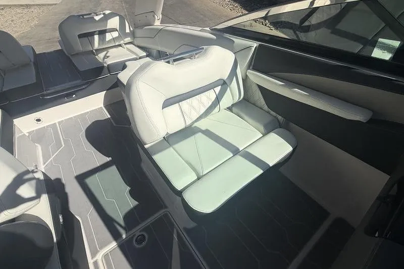 Slide: The Image of 2023 Regal LS4 Surf boat interior with luxurious seating and modern design. - 15