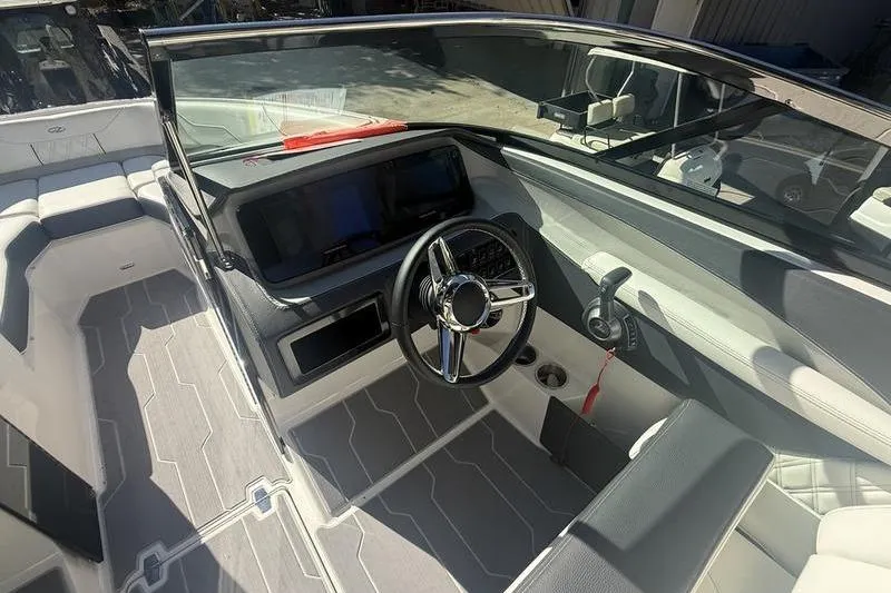 Slide: The Image of 2023 Regal LS4 Surf boat interior with modern dashboard and steering wheel. - 17