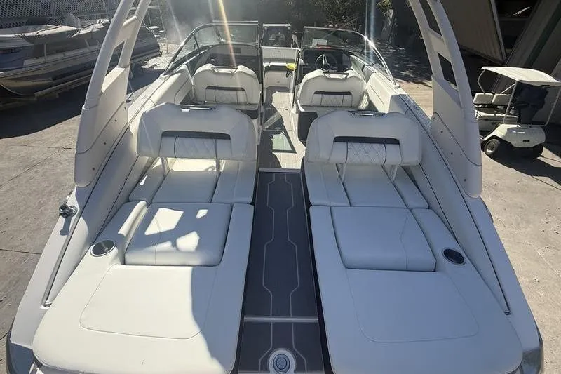 Slide: The Image of 2023 Regal LS4 Surf boat interior with luxurious white seating and modern design. - 4