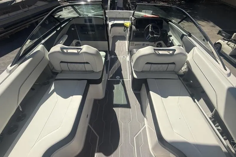 Slide: The Image of 2023 Regal LS4 Surf boat interior with sleek seating and modern design. - 5