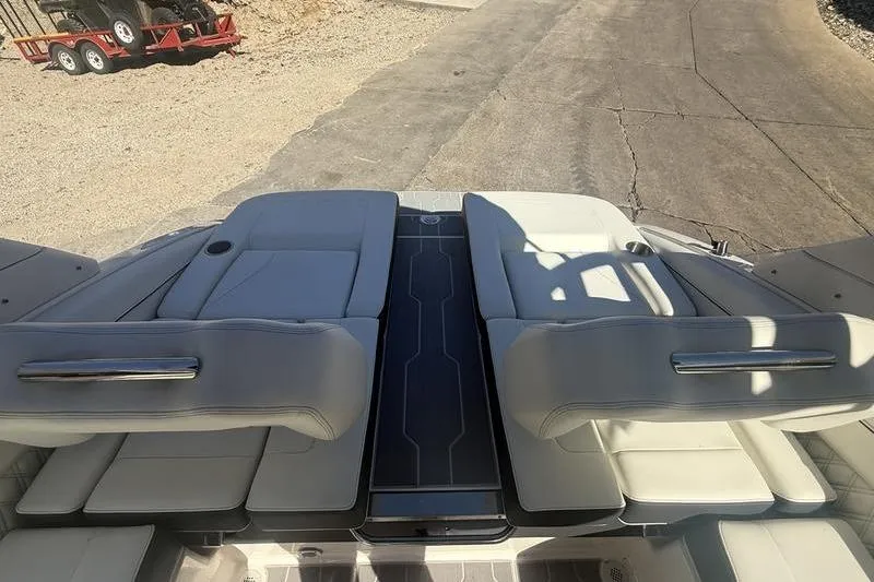Slide: The Image of 2023 Regal LS4 Surf boat interior with luxurious seating and sleek design. - 7