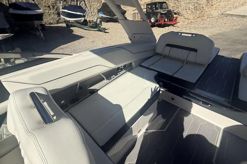 Slide: The Image of 2023 Regal LS4 Surf boat interior with sleek seating and modern design. - 9