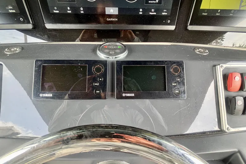 Slide: The Image of Control panel of a 2016 Hydra-Sports 4200 Siesta boat with Yamaha displays. - 23