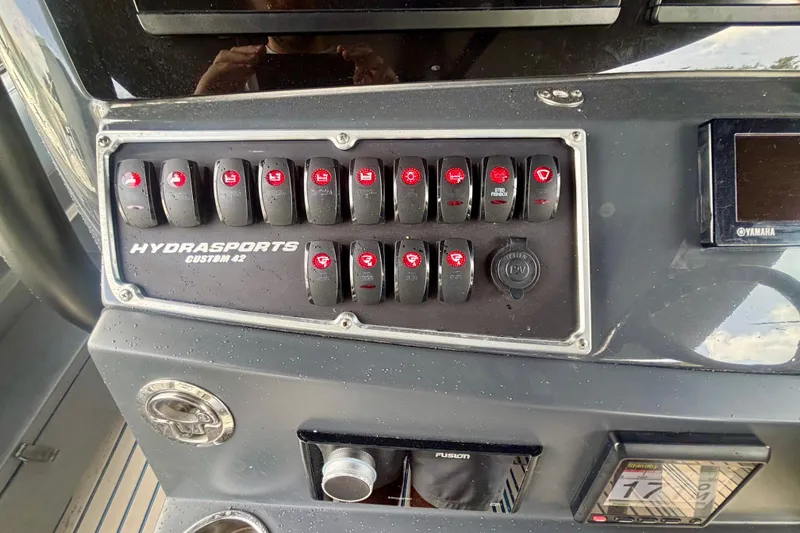 Slide: The Image of Control panel of 2016 Hydra-Sports 4200 Siesta boat with labeled switches and displays. - 24
