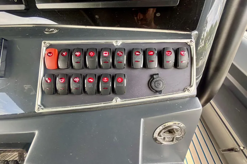 Slide: The Image of Control panel of a 2016 Hydra-Sports 4200 Siesta boat with labeled switches. - 29