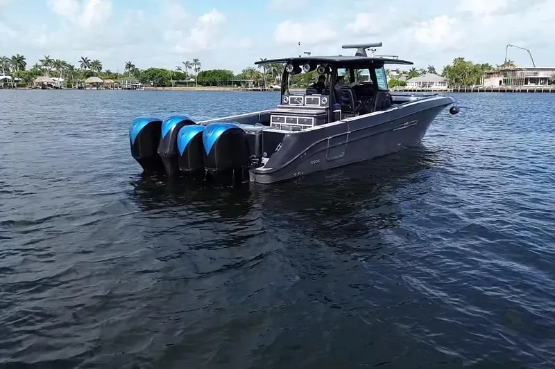 Slide: The Image of 2016 Hydra-Sports 4200 Siesta boat with four engines on calm water. - 3