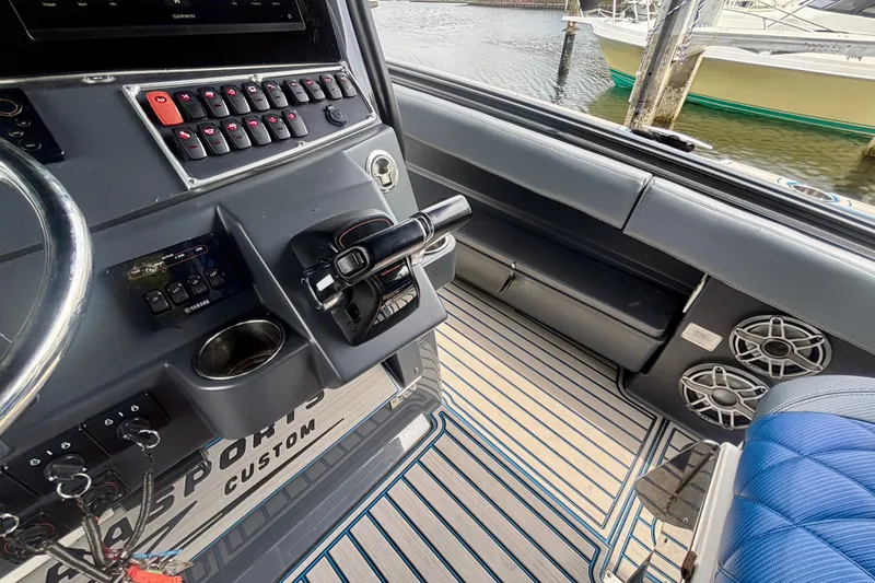 Slide: The Image of 2016 Hydra-Sports 4200 Siesta boat cockpit with control panel and seating. - 30
