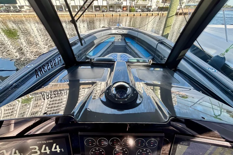 Slide: The Image of 2016 Hydra-Sports 4200 Siesta boat dashboard with navigation instruments and waterfront view. - 31