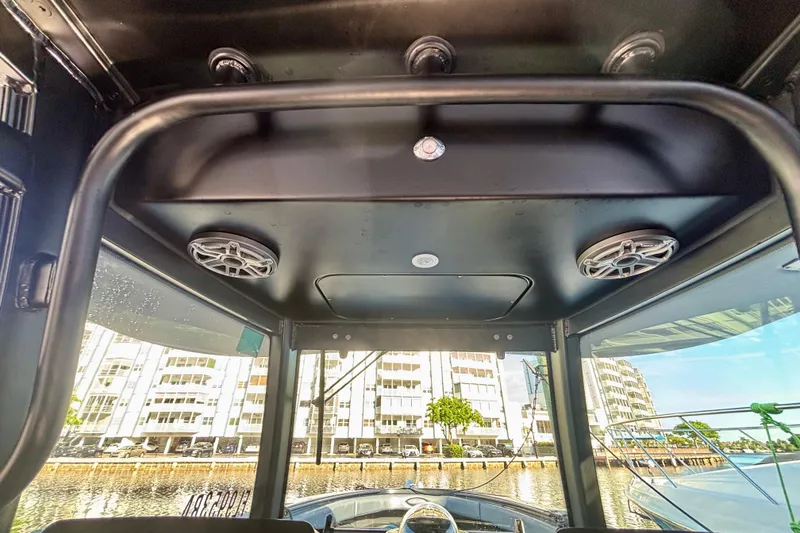 Slide: The Image of 2016 Hydra-Sports 4200 Siesta boat interior with speakers, cityscape view. - 33