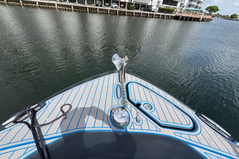 Slide: The Image of Bow view of 2016 Hydra-Sports 4200 Siesta boat on calm water near a dock. - 4