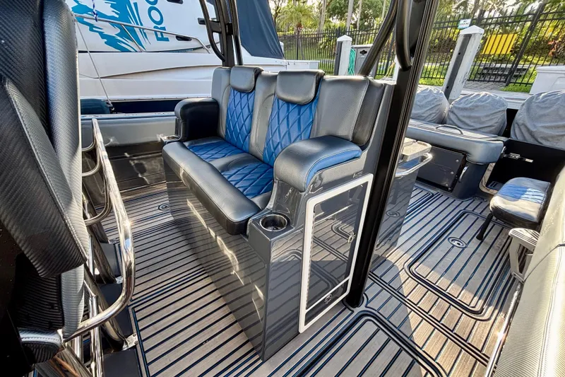 Slide: The Image of 2016 Hydra-Sports 4200 Siesta interior with blue seating and sleek design. - 40