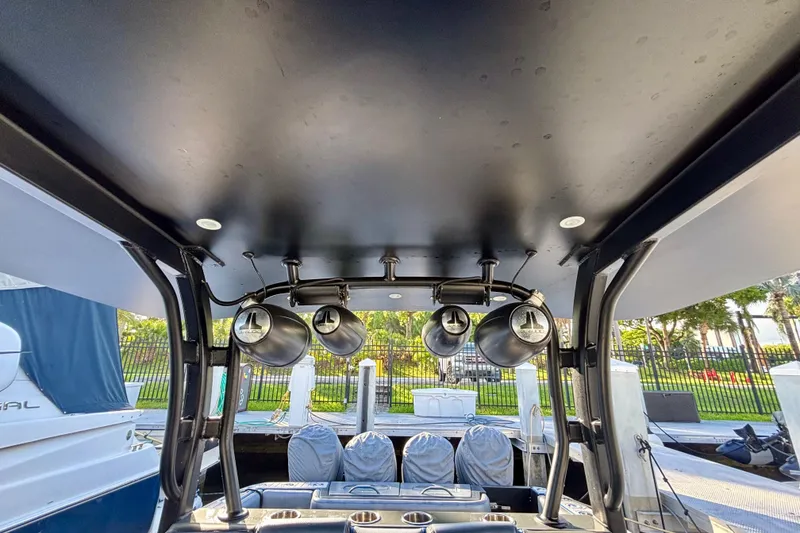 Slide: The Image of 2016 Hydra-Sports 4200 Siesta boat interior with mounted speakers and covered seats. - 41