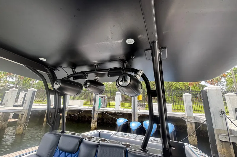 Slide: The Image of 2016 Hydra-Sports 4200 Siesta boat with mounted speakers and sleek interior design. - 42