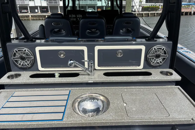 Slide: The Image of 2016 Hydra-Sports 4200 Siesta boat interior with sink, speakers, and seating. - 48